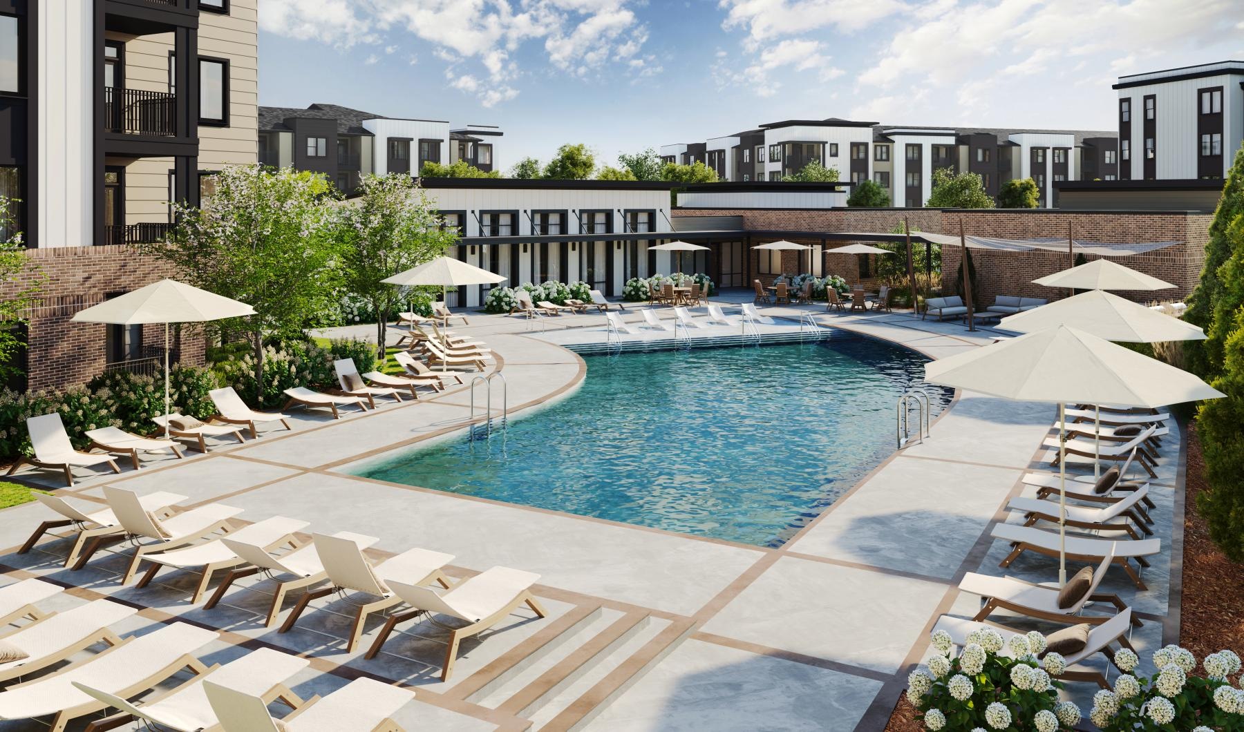 a pool with lounge chairs around it